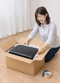スーツケースを段ボールに梱包する